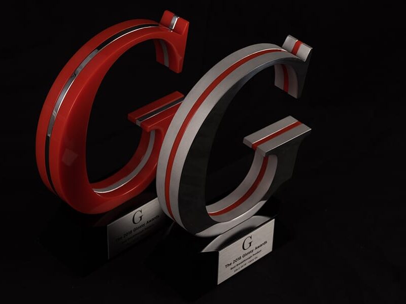 Red And Gray Acrylic And Metal Awards Of Company Logo