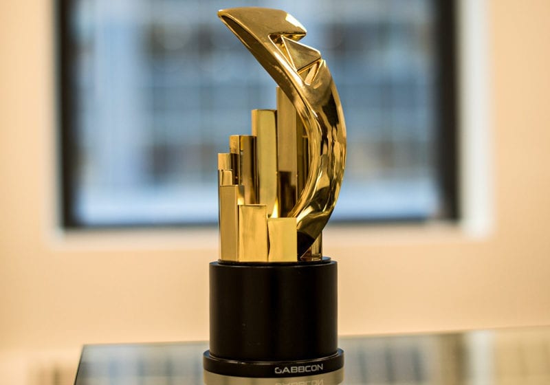 Gold Award With Pillars And Play Button And Black Wood Base