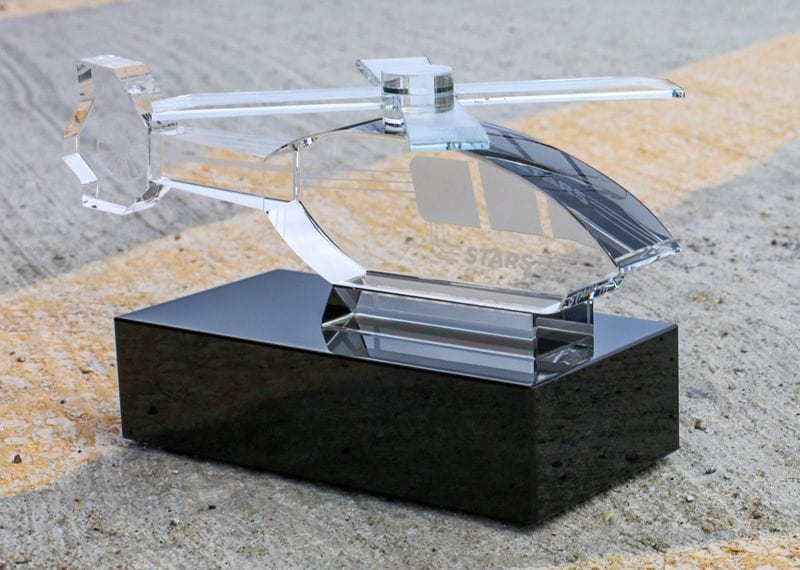 Crystal helicopter replica on black crystal base