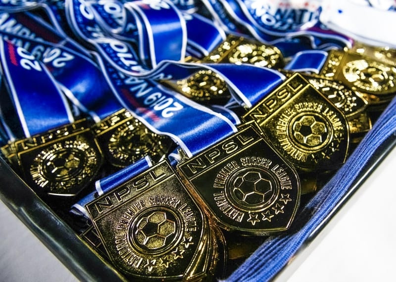 gold medals with blue ribbon