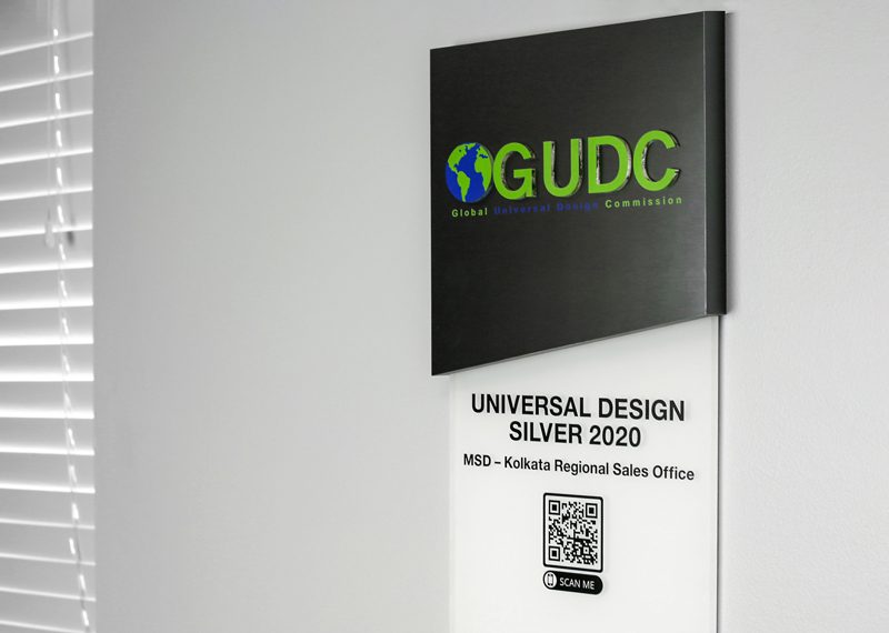 Metal and acrylic building signage with qr code and brail writing