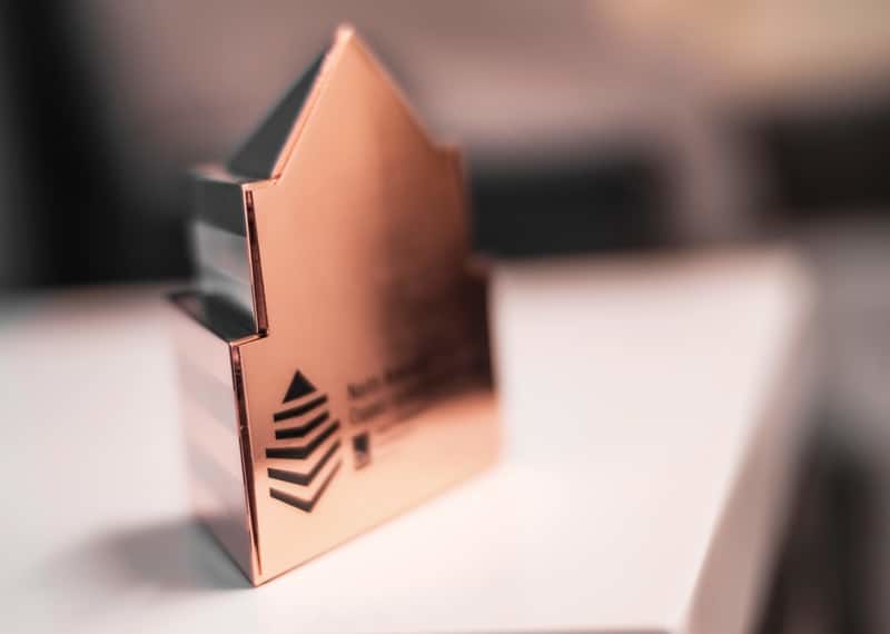 Metal cast copper metal building shape award