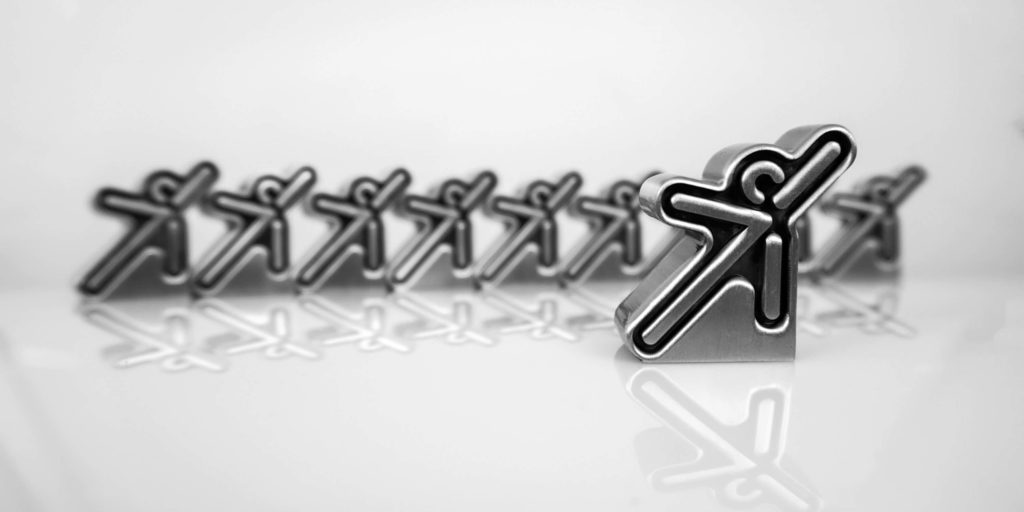 Metal diestamp figures with black enamel fill