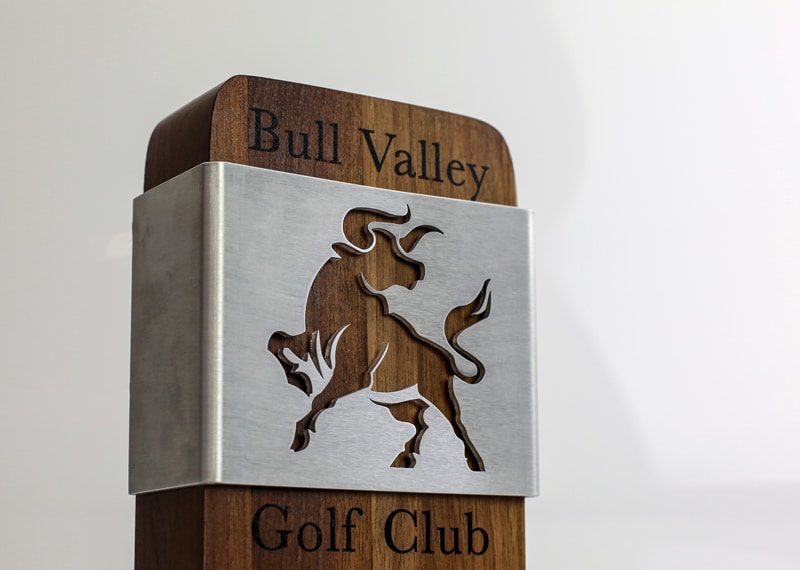 Wood pillar with digital print personalization. Metal plate wrapped around it
