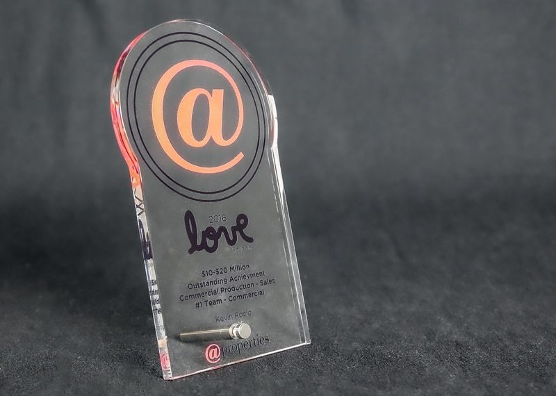 glass award with metal stand post