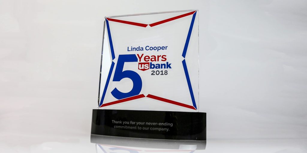 5 year service award. Clear crystal panel on black crystal base.