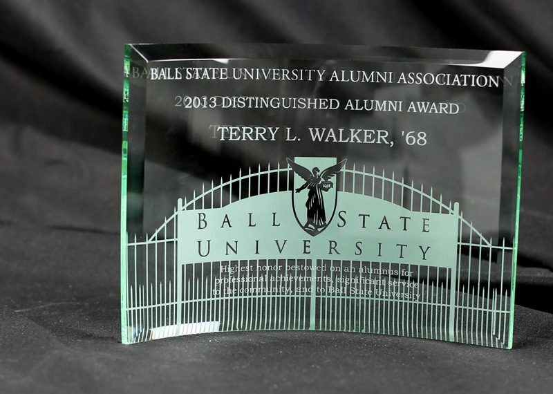 curved glass award with sand etching