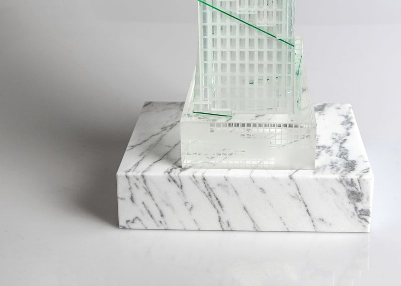 crystal building replica on marble base