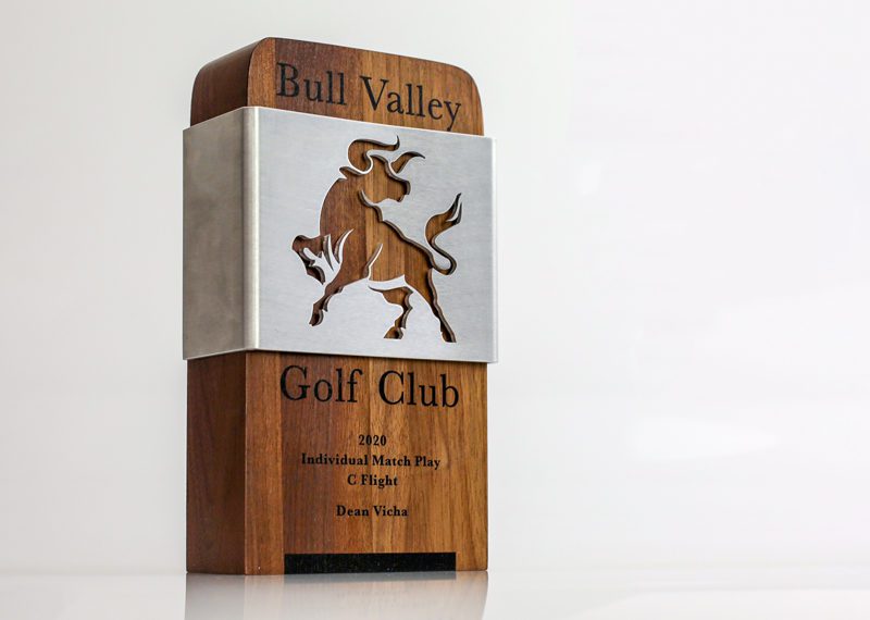 Wooden trophy with metal cut out bull wrapped around. Digital print on the wood.