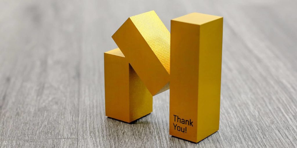 golden statue with thank you engraved