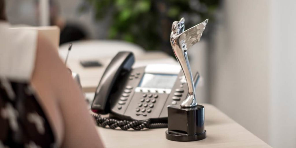 employee award trophy on desk